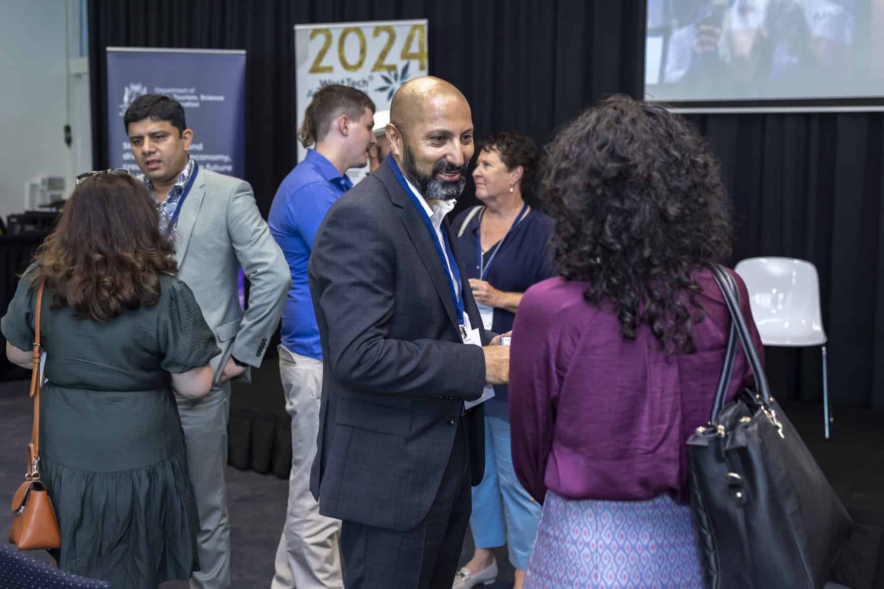 WTA 2024 Attendees mingle during Tea Break